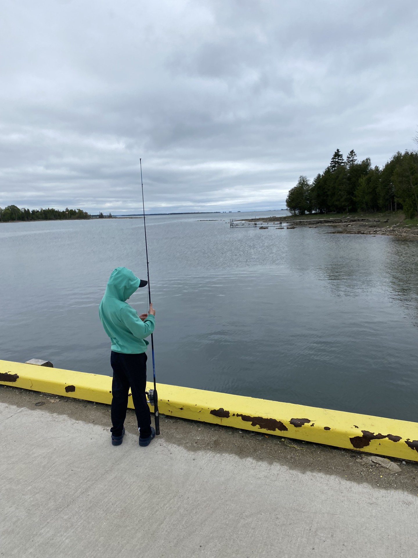 Fishing off the pier at Howdenvale Bay