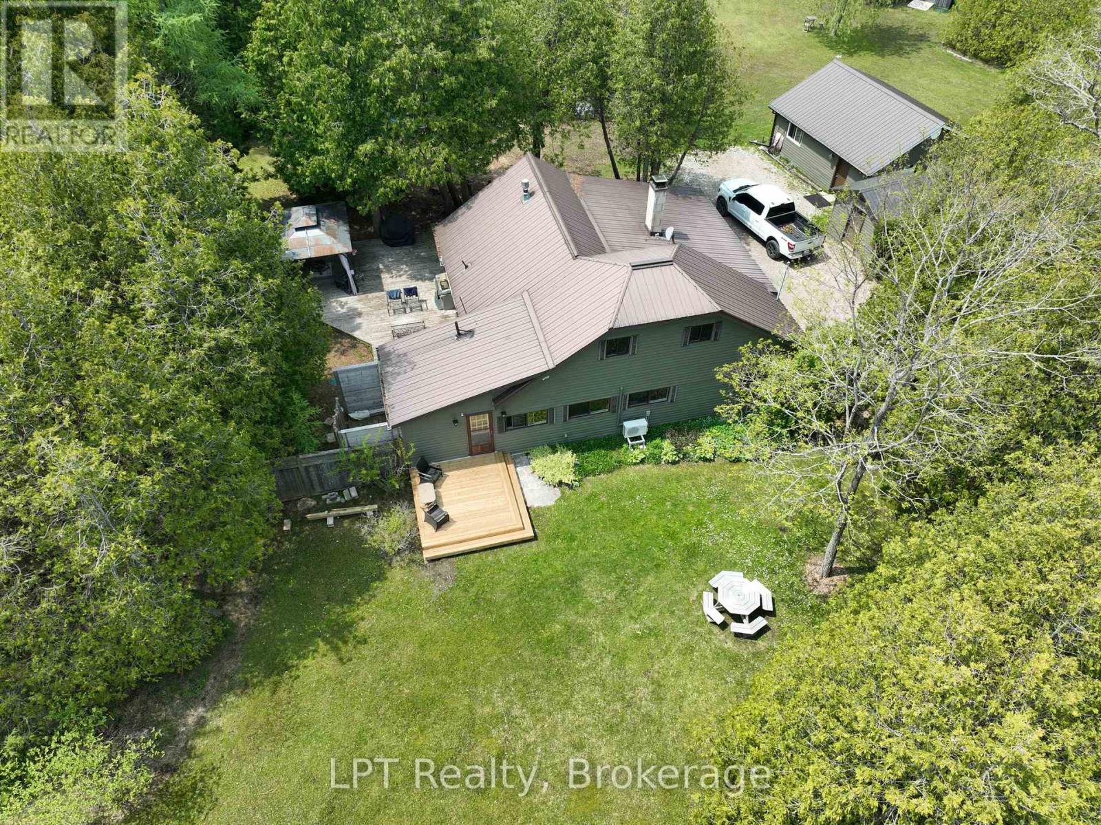 Aerial view of the house, decks and driveways at 21 Tyson Lane